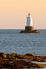 Sakonnet Lighthouse Tower As Sun Lowers Over Horizon